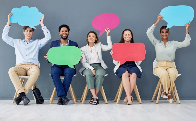 Image of happy people holding speech bubbles